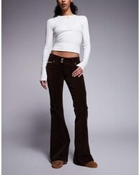 Juicy Couture - Flare Diamante Logo Low Rise Jeans - Lyst