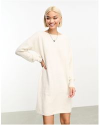 Vero Moda - Robe pull courte en maille - crème - Lyst