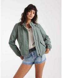 Vero Moda - Short Festival Rain Coat With Hood And Drawstring Hem - Lyst