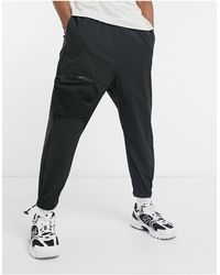 ASOS Oversized Tapered sweatpants With Cargo Pockets - Black