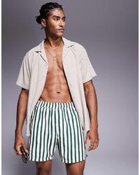 ASOS - Pantaloncini Da Bagno Taglio Medio Verdi A Righe - Lyst