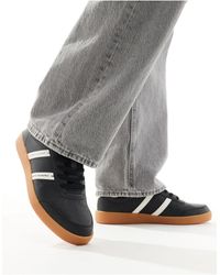 Armani Exchange - Sneakers bianco sporco e nere con doppie righe con logo e suola - Lyst
