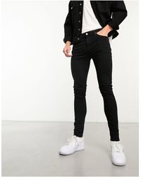 Calvin Klein - Jeans super skinny neri - Lyst