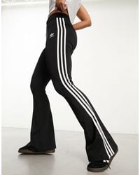 adidas Originals - Three Stripe Flared leggings - Lyst