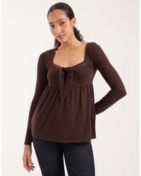 Hollister - Long Sleeve Front Bow Babydoll Top - Lyst