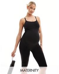 Mama.licious - Mamalicious maternity - tuta aderente sportiva con pantaloncini nera - Lyst
