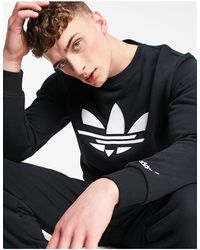 Jerséis, cárdigans y sudaderas adidas para hombre en rebajas | FASHIOLA.es