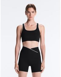 Oysho - Medium-support Comfortlux Sports Bra With Contrast Seams - Lyst