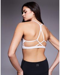 4505 - Open Back Light Support Sports Bra With Removable Padding - Lyst