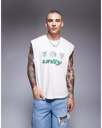 ASOS - Camiseta Color Crema Sin Mangas De Corte Cuadrado Extragrande Con Estampado Gráfico Deportivo De Texto De -Blanco - Lyst