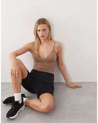 4505 - Plush Handle Ruched Side Vest With Inner Bra - Lyst
