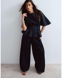 ARRANGE - Denim Pleat Detail Pants - Lyst