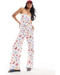 ASOS - Pantalon d'ensemble texturé ample à imprimé aliments estivaux - Lyst