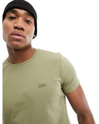 Calvin Klein - T-shirt slim fit elasticizzata delta - Lyst