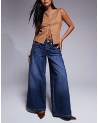 River Island - Petite - jean palazzo - foncé délavé - Lyst