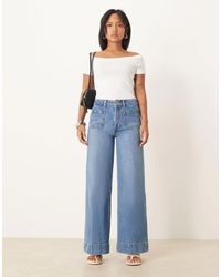 ASOS - Asos Design Petite High Rise Wide Leg Jeans With Front Pockets In Mid - Lyst