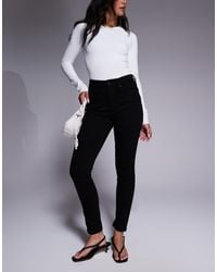 GOOD AMERICAN - Jeans Skinny Neri - Lyst