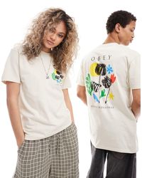 Obey - T-shirt a maniche corte unisex beige con grafica con fiori - Lyst