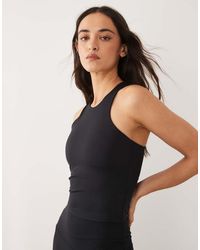 4505 - Icon Active Racer Back Tank Top With Inner Bra And Removable Padding - Lyst
