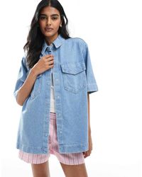 ONLY - Camicia Oversize A Maniche Corte Azzurra Con Tasche Sul Davanti - Lyst