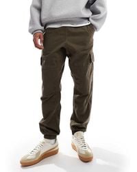 New Look - Pantaloni Cargo Slim Color Kaki Scuro Con Fondo Elasticizzato - Lyst