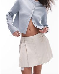 TOPSHOP - Mini-jupe plissée à taille basse en sergé avec poches apparentes en popeline - ivoire - Lyst