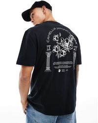 ASOS - Camiseta negra holgada con estampado floral en la espalda - Lyst