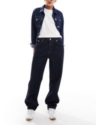 Calvin Klein - Jean ample style années 90 - foncé brut délavé - Lyst