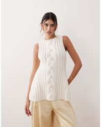 ARRANGE - Chunky Cable Knit Peplum Top - Lyst