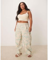 ASOS - Curve – hose mit weitem beinschnitt, vintage-blumenmuster und ziernaht - Lyst