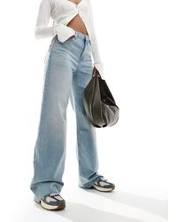 Mango - Jeans slim chiaro vestibilità comoda con dettagli slavati sul davanti - Lyst