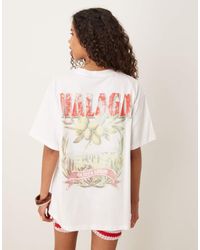 ASOS - Camiseta Extragrande Con Estampado Gráfico De Olivas Y Texto "Malaga" De -Blanco - Lyst