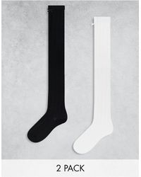 Monki - Confezione da 2 paia di calze al ginocchio bianche e nere - Lyst