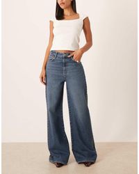 Mango - 100% Katoenen Jeans Met Wijde Pijpen En Studs - Lyst