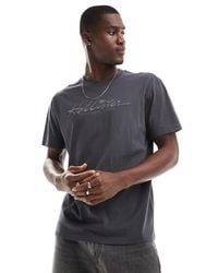 Hollister - Camiseta negra holgada con bordado a tono del logo - Lyst