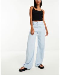 Mango - Pantaloni modello jeans extra larghi azzurri - Lyst