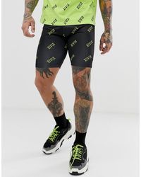 ASOS Co-ord megging Shorts With Roman Numerals Print - Black