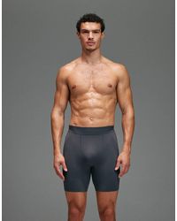 4505 - Seamless Physique Defining Compression Base Layer 8 Inch Half Tight - Lyst