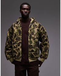 Carhartt - – vista – gesteppte oversize-kapuzenjacke mit military-muster - Lyst