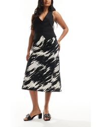 New Look - Falda midi negra con diseño estampado - Lyst