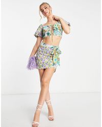 Love Triangle - Minifalda anudada en el lateral con estampado floral llamativo - Lyst