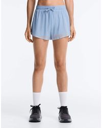 Oysho - Technical Mid Rise 2-In-1 Check Shorts - Lyst