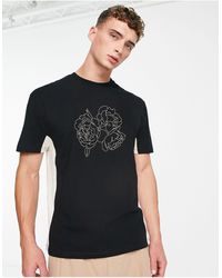 ASOS - Camiseta negra y blanco hueso holgada con diseño color block y estampado dividido - Lyst
