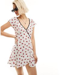 Motel - Ditsy Rose Print Wrap Detail Mini Dress - Lyst