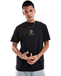 Timberland - T-Shirt Nera Con Logo Piccolo Al Centro - Lyst