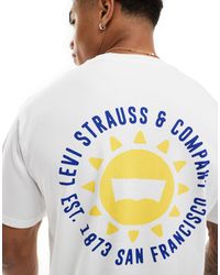 Levi's - T-shirt bianca con stampa di sole e logo al centro e sul retro - Lyst