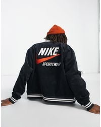 Nike - Chaqueta bomber negra con logo en la espalda trend - Lyst