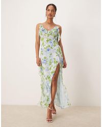 Mango - Robe fendue sur le côté à imprimé végétal avec col v et volants - pâle - Lyst