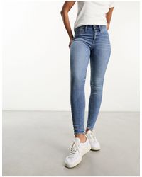 River Island - Jeans skinny modellanti lavaggio medio - Lyst
