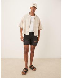 ASOS - Pantaloncini Di Jeans Slim Taglio Medio Neri Con Strappi - Lyst